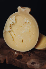 Delicious Caciocavallo cheese on a wooden board