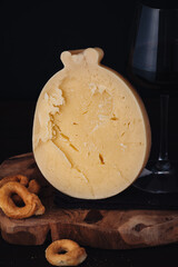 Delicious Caciocavallo cheese with red wine and taralli