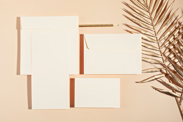 Mockup of blank cards and envelopes over neutral beige background