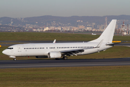 Withe Boeing 737-800 airplane on the runway