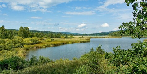 Fototapeta na wymiar Padrť pond in the protected landscape area of Brdy, a well-known tourist destination in the heart of Brdy, near the defunct village of Padrť in former millitary area - Dolejší Padrťský pond