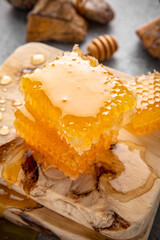 Honey comb. A useful fortified bee product for health and beauty. Vegetarian dietary organic product. Beautiful still life.