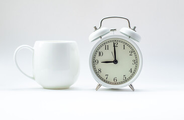 alarm clock and cup of tea