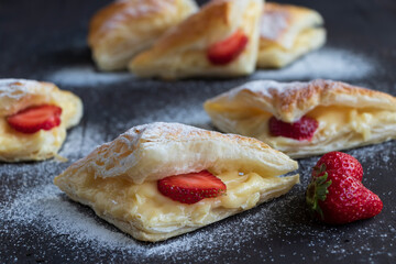 Dessert with fresh strawberry. Homemade dessert on black background.