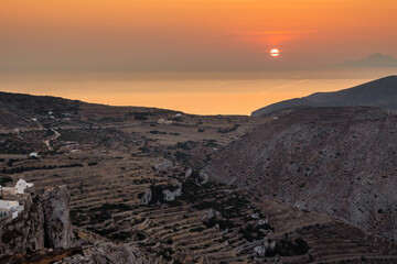 Rocky coast of Folegandros island during sunset. Cyclades, Greece