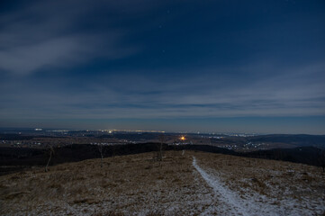 Panorama of a winter village at night in the mountains