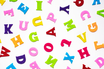 English alphabet letters on white background pattern.