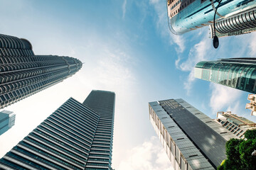 Looking up to the skyscraper's buildings. Modern business architecture and abstract architectural design. Modern architecture Urban Geometry concept image.