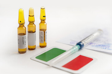 Vaccine and syringe injection. Vaccine bottles , syringe and doctor's appointment. Medicine infectious concept. Italian flag