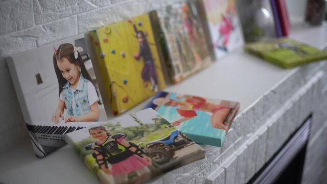 exhibition of photos, photocanvases, active little girl.