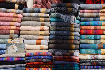 Colorful Alpaca scarves, shawls, and clothing, tourist souvenirs, Pisac, Peru