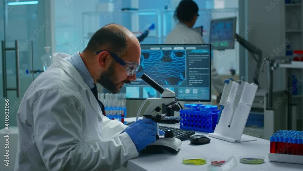 Aufkleber medical research scientist conducting vaccine development under digital microscope in a biological a
