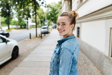 Young woman turning to glance behind her