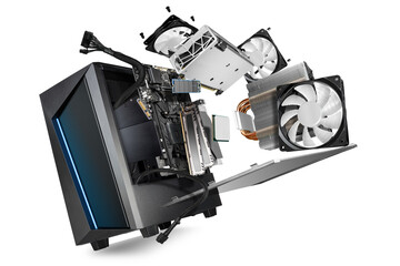 flying parts of a modern computer. hardware components mainboard cpu processor graphic card RAM cables and cooling fan flying out of black blue PC case isolated abstract technology background