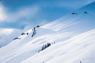 Winter landscape with beautiful snow-covered mountain in the clear morning sunlight. Swiss Alps.