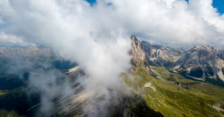 Amazing aerial top view on Seceda Mount peak and valley from drone. Trentino Alto Adige, Dolomites Alps, South Tyrol, Italy, Europe near Ortisei.