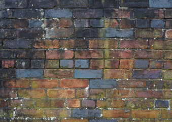 Multicoloured brick fence wall
