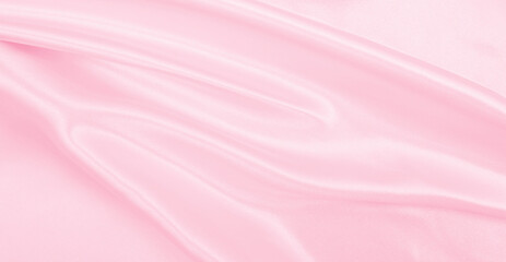 Smooth elegant pink silk or satin texture as wedding background. Luxurious background design