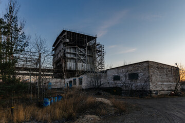 Fototapeta na wymiar Old abandoned industrial building waiting for demolition