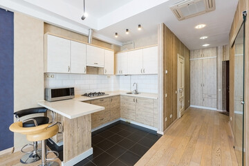 Interior of luxury kitchen in white colors, smart apartment in loft style. real object