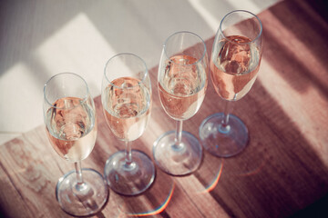 four glasses of white wine on a morning table in provence