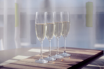 four glasses of white wine on a morning table in provence