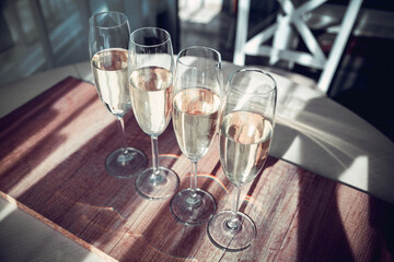 four glasses of white wine on a morning table in provence