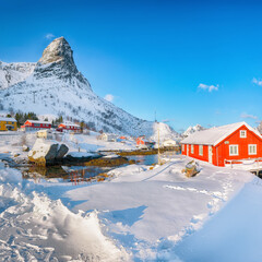 Gorgeous winter  view on Reine Village and Gravdalbukta bay with cracked ice