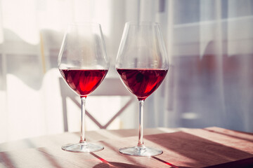 red French wine in a glass on the table