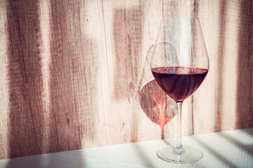 red French wine in a glass on the table