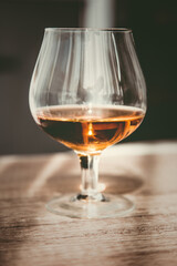 a glass of elite cognac on the bar