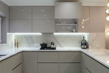 Luxury white modern marble kitchen in studio space - 410510659
