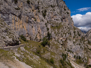 The Cares Route in the heart of Picos de Europa National Park, Cain-Poncebos, Asturias, Spain. Narrow and impressive canyon between cliffs, bridges, caves, footpaths and rocky mountains.