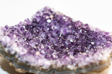 Amethyst geode section filled with small crystals throughout.
