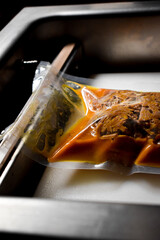 high vacuum food sealing process. Meat in the process of vacuum sealing