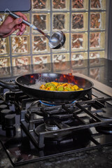 Roast some habanero peppers in a black skillet over high heat. Process of making a chili sauce