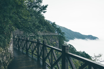 Fototapeta na wymiar Wooden gallery road by cliff on top of Wugong Mountain in Jiangxi, China
