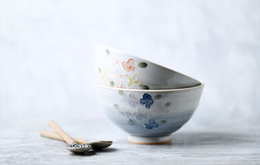 Fototapeta na wymiar Traditional ceramic bowls on bright background