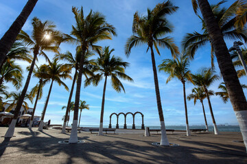 Obraz premium Famous Puerto Vallarta sea promenade, El Malecon, with ocean lookouts, beaches, scenic landscapes hotels and city views.