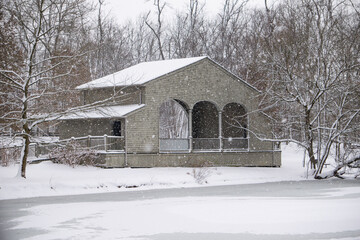 Fototapeta na wymiar Pavilion in a Snowy Park