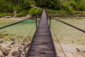 Fototapeta premium Hanging bridge over Soca river near Bovec village, Slovenia
