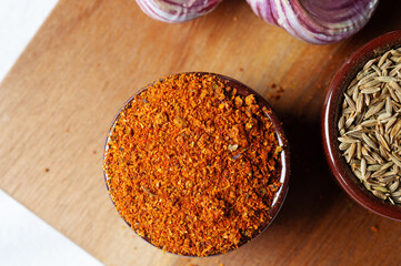 Spices and herbs in ceramic bowls. Food and cuisine ingredients. Colorful natural additives.