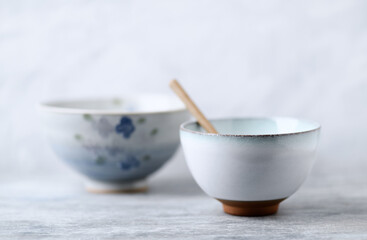 Traditional ceramic bowls on bright background