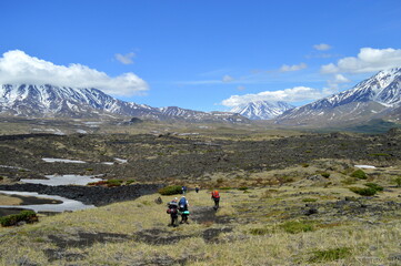 Hikers in the wide vulcano landscape close Tolbachik volcano in the far east peninsula of Kamchatka in Russia