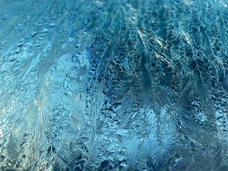 Blue and white Frost on Window in Winter