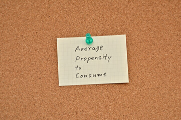 A piece of paper labeled average propensity to consume is pinned to the corkboard.