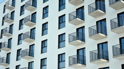 Modern apartment building in sunny day. Exterior, residential house facade.