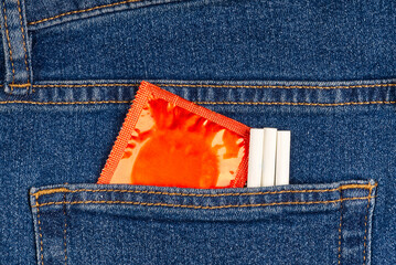Condom pack in the blue jeans back pocket