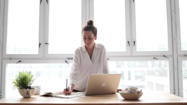 Young adult female professional working in a modern office
