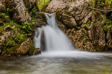 Fototapeta na wymiar Small waterfall at Mlinski potok stream in Durmitor mountains, Montenegro